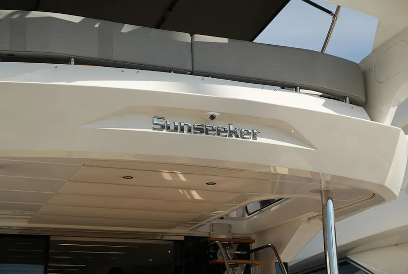  Yacht Photos Pics Sunseeker Manhattan 66 yacht, 2017 model, rear view with logo and seating area.