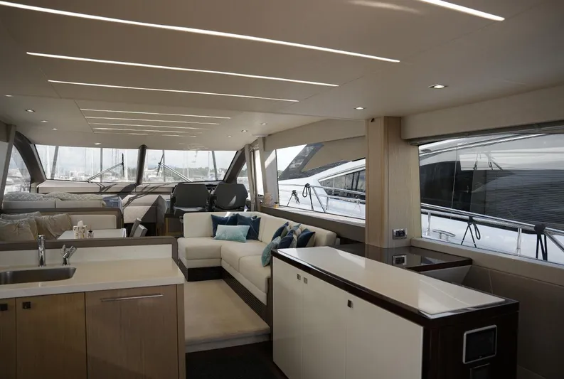  Yacht Photos Pics Luxurious interior of 2017 Sunseeker Manhattan 66 yacht with modern furnishings and large windows.