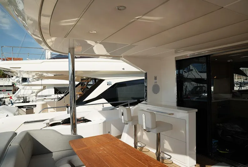  Yacht Photos Pics Luxurious Sunseeker Manhattan 66 yacht deck with seating and bar area, 2017 model.