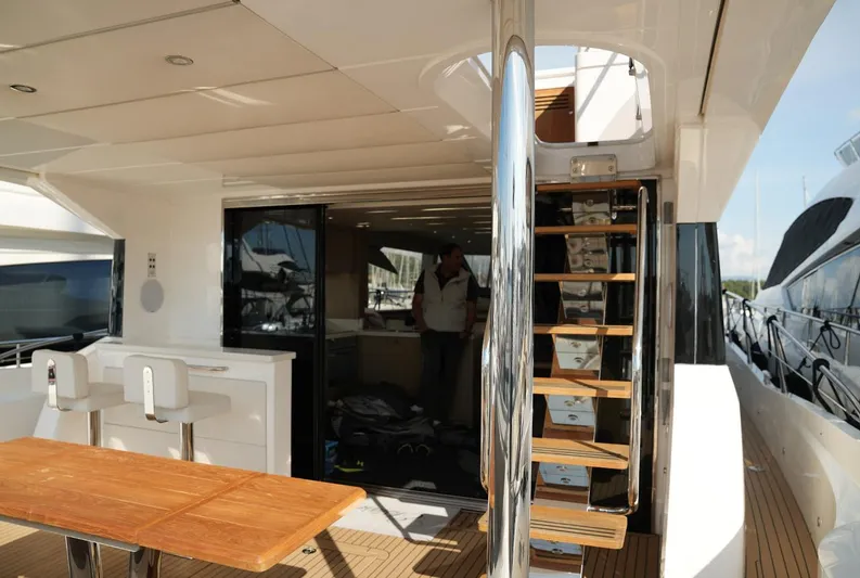  Yacht Photos Pics Luxurious Sunseeker Manhattan 66 yacht interior with wooden stairs and seating, 2017 model.