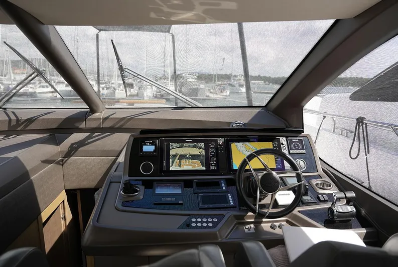  Yacht Photos Pics Cockpit of 2017 Sunseeker Manhattan 66 yacht with advanced navigation controls and displays.