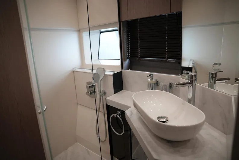  Yacht Photos Pics Luxurious bathroom in 2017 Sunseeker Manhattan 66 yacht with modern fixtures and elegant design.