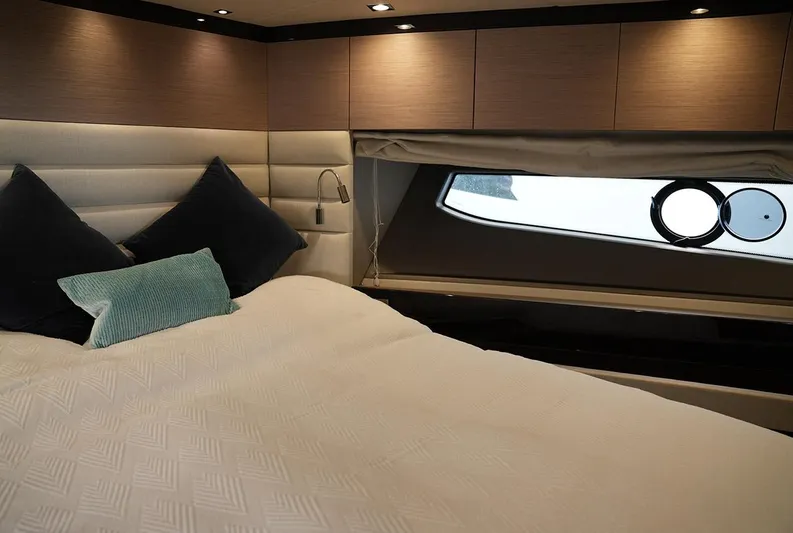  Yacht Photos Pics Luxurious bedroom interior of 2017 Sunseeker Manhattan 66 yacht with modern design and window view.