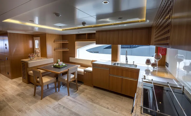 Sehamia Yacht Photos Pics Luxurious interior of 2018 Gulf Craft Majesty 155 yacht with modern kitchen and dining area.