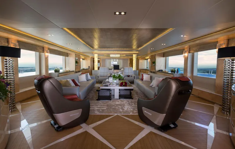 Sehamia Yacht Photos Pics Luxurious interior of 2018 Gulf Craft Majesty 155 yacht with elegant seating and panoramic windows.