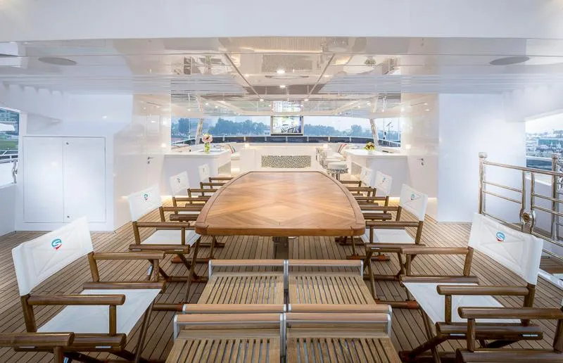 Sehamia Yacht Photos Pics Luxurious Gulf Craft Majesty 155 yacht interior, featuring elegant wooden dining area, 2018 model.