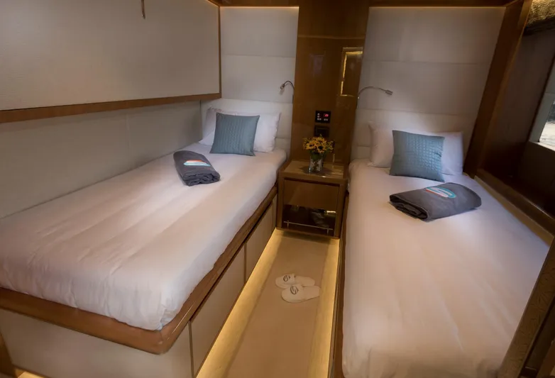 Sehamia Yacht Photos Pics Luxurious twin cabin in 2018 Gulf Craft Majesty 155 yacht, featuring elegant bedding and ambient lighting.