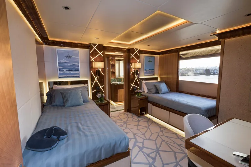 Sehamia Yacht Photos Pics Luxurious twin bedroom on 2018 Gulf Craft Majesty 155 yacht, featuring elegant decor and ambient lighting.
