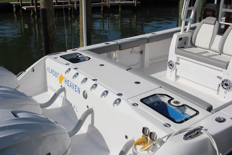  Yacht Photos Pics 2024 Everglades 395 Center Console boat interior with seating and fishing equipment.