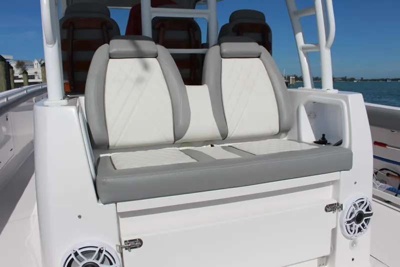  Yacht Photos Pics 2024 Everglades 395 Center Console boat seating with white and gray cushions.