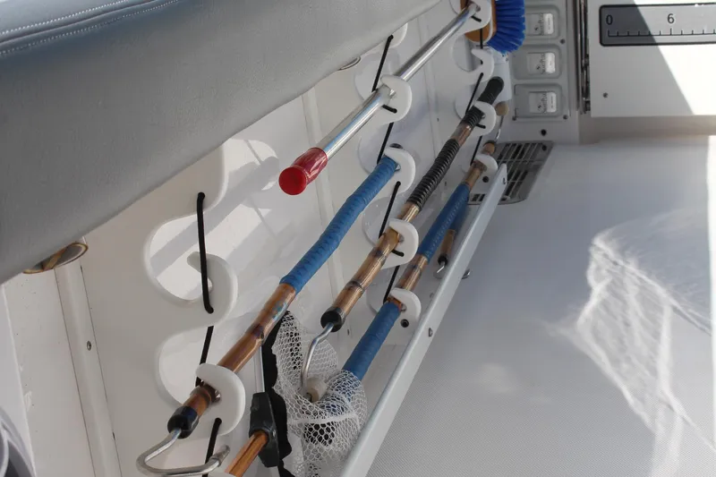  Yacht Photos Pics 2024 Everglades 395 Center Console fishing rod holders and storage area.