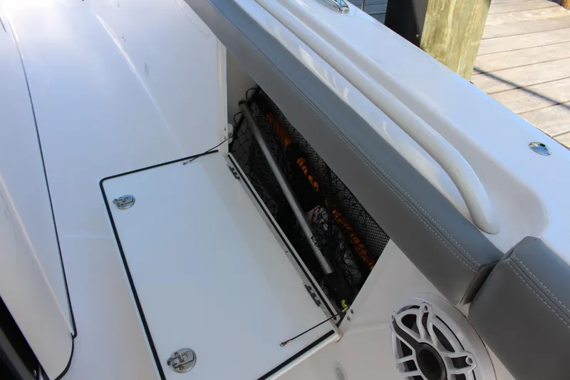  Yacht Photos Pics 2024 Everglades 395 Center Console boat with open storage compartment and speaker.