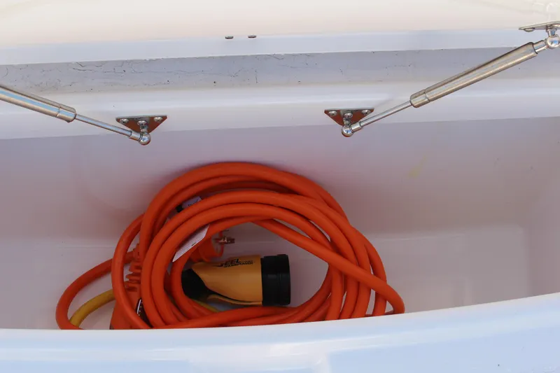  Yacht Photos Pics Storage compartment with orange hose in 2024 Everglades 395 Center Console boat.