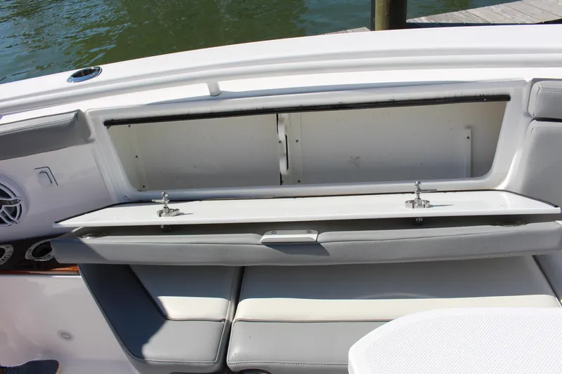  Yacht Photos Pics 2024 Everglades 395 Center Console boat seating with open storage compartment.
