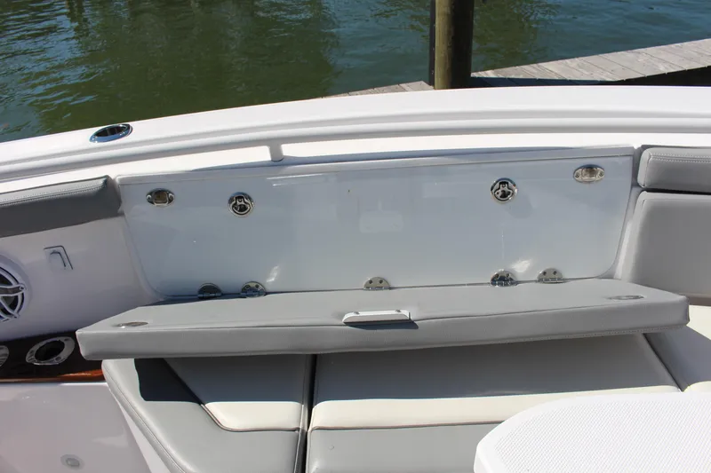  Yacht Photos Pics 2024 Everglades 395 Center Console boat seating area with cushioned bench and sleek design.