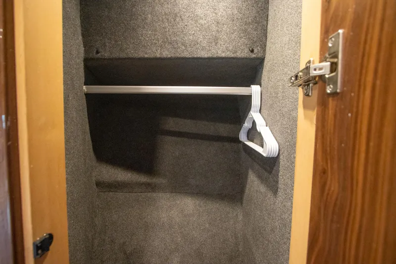  Yacht Photos Pics Empty closet with hangers in 2024 Riviera 4600 SY yacht.