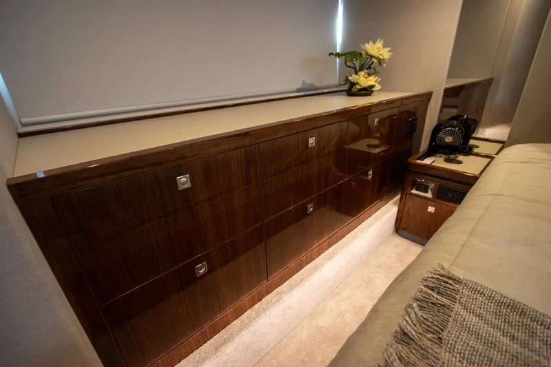  Yacht Photos Pics Luxurious interior of 2024 Riviera 4600 SY yacht with elegant wood cabinetry.