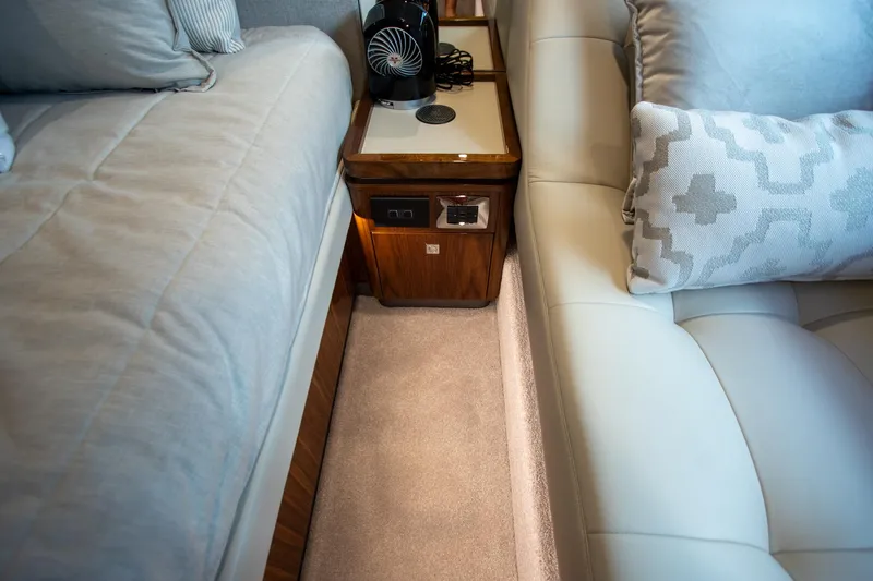  Yacht Photos Pics Luxurious interior of 2024 Riviera 4600 SY yacht with plush seating and elegant wood accents.