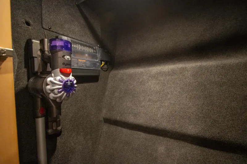  Yacht Photos Pics Dyson vacuum mounted in 2024 Riviera 4600 SY yacht interior.