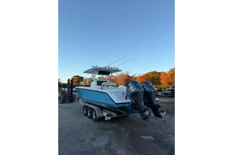  Yacht Photos Pics 2001 Venture 34 Center Console boat with dual outboard engines on a trailer.