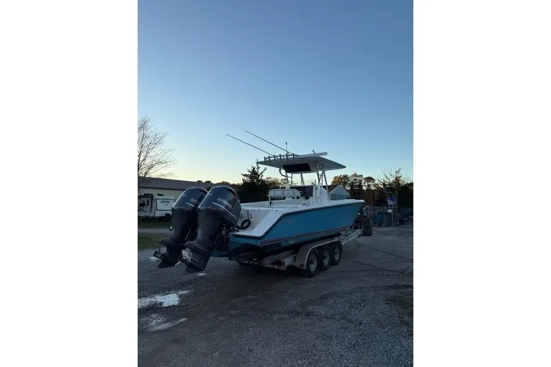  Yacht Photos Pics 2001 Venture 34 Center Console boat on trailer with dual outboard motors.