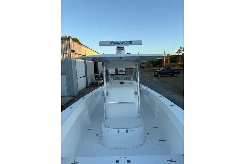  Yacht Photos Pics 2001 Venture 34 Center Console boat with T-top, docked outdoors.