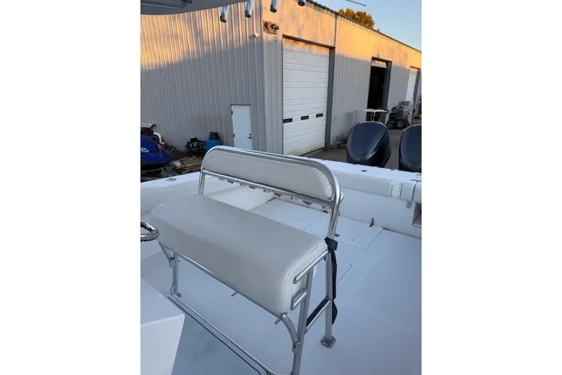  Yacht Photos Pics 2001 Venture 34 Center Console boat with white seating and outdoor storage background.