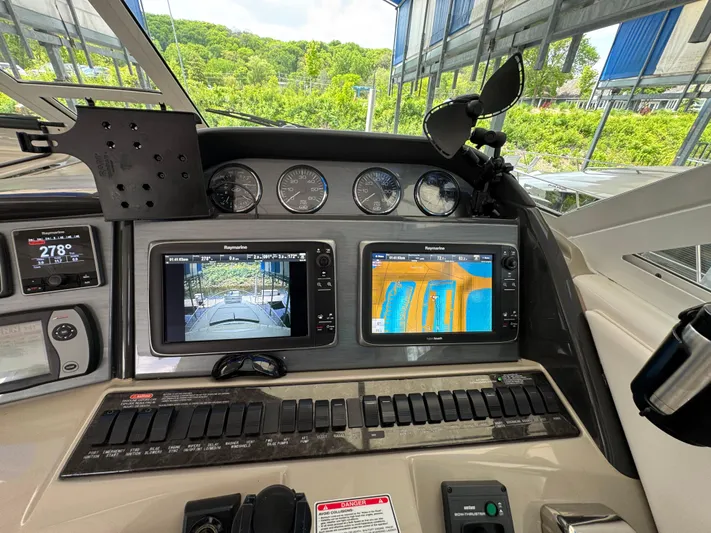 Intermission Yacht Photos Pics 2005 Sea Ray 390 Motor Yacht dashboard with navigation screens and controls.
