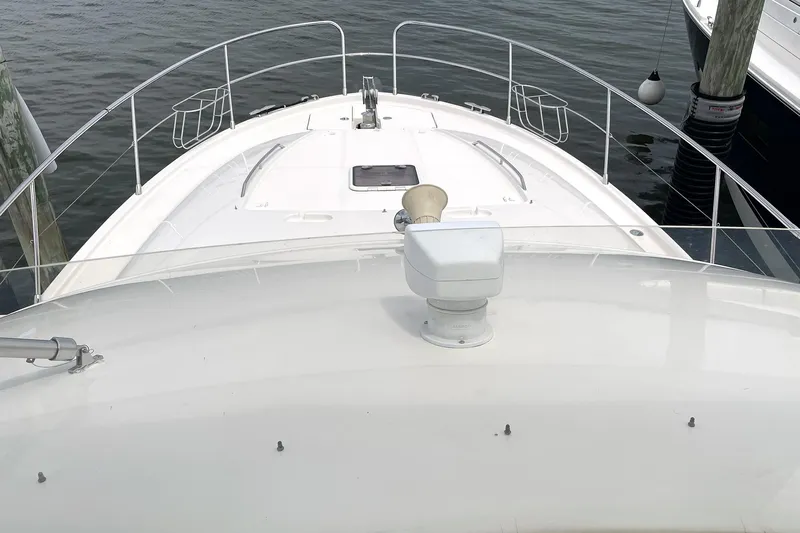 Our Three Buoys Yacht Photos Pics Bow view of 2007 Jeanneau Prestige 46 yacht docked at marina.