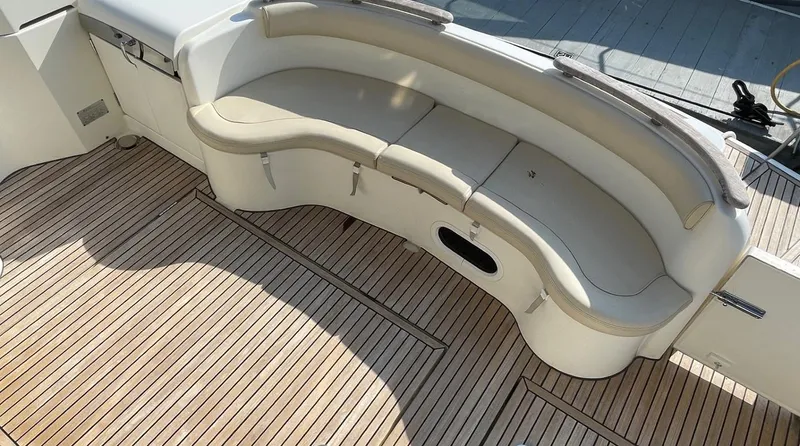 Our Three Buoys Yacht Photos Pics Luxury seating on 2007 Jeanneau Prestige 46 yacht with teak deck.