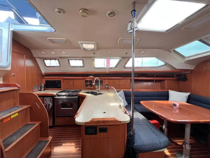 Mariah Yacht Photos Pics Interior of 2008 Hunter 41 Deck Salon with modern kitchen and dining area.