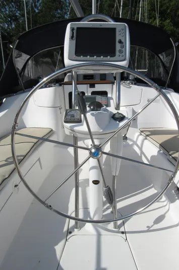 Mariah Yacht Photos Pics 2008 Hunter 41 Deck Salon yacht cockpit with steering wheel and navigation equipment.
