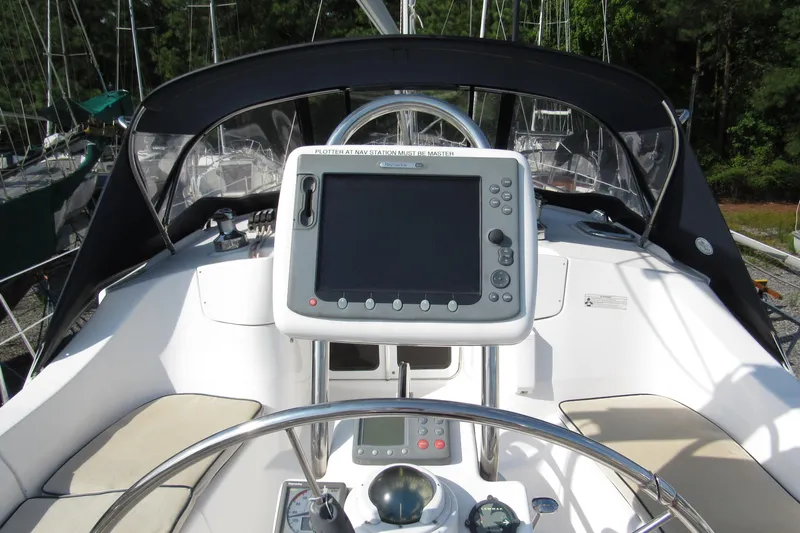 Mariah Yacht Photos Pics 2008 Hunter 41 Deck Salon yacht cockpit with navigation system and steering wheel.