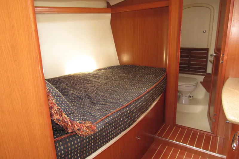 Mariah Yacht Photos Pics 2008 Hunter 41 Deck Salon interior with cozy bed and adjacent bathroom.