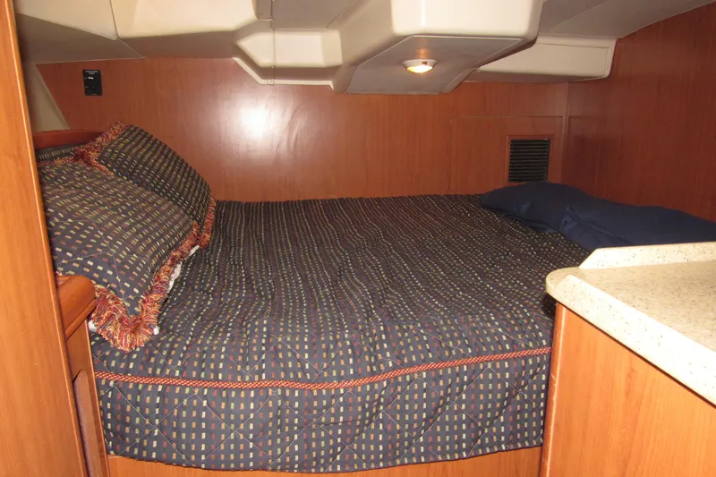 Mariah Yacht Photos Pics 2008 Hunter 41 Deck Salon interior cabin with cozy bed and wooden paneling.