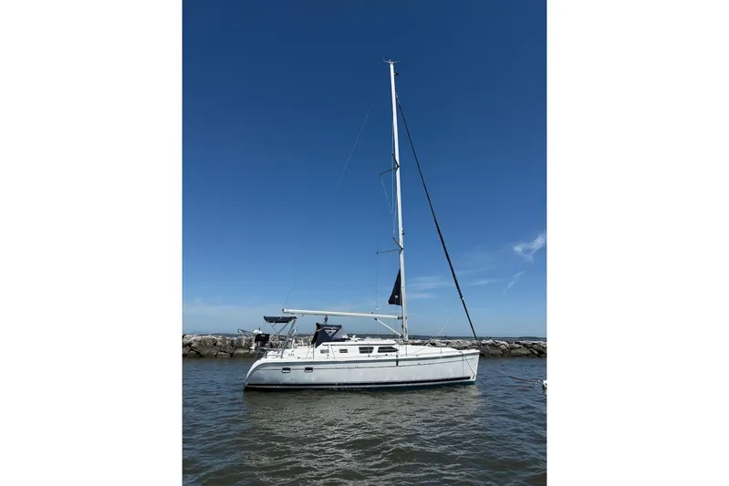 Mariah Yacht Photos Pics 2008 Hunter 41 Deck Salon sailboat on calm water under clear blue sky.