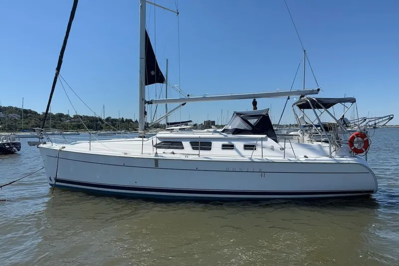 Mariah Yacht Photos Pics 2008 Hunter 41 Deck Salon sailboat on calm water, clear sky background.