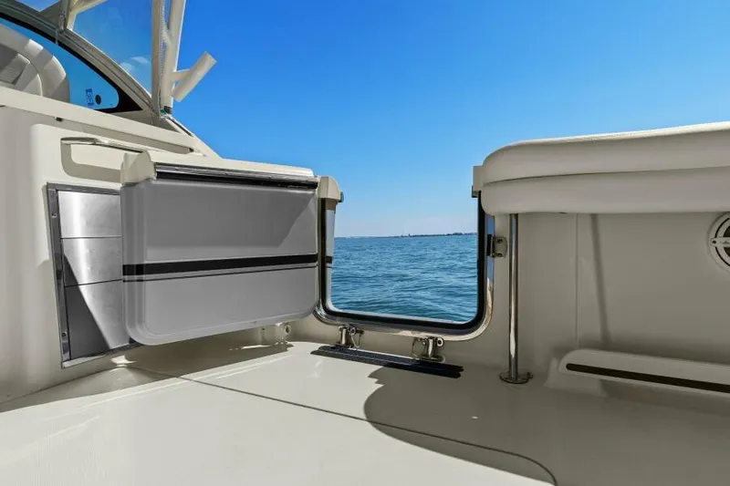  Yacht Photos Pics 2016 Grady-White Freedom 375 boat interior with open door, ocean view, and clear blue sky.
