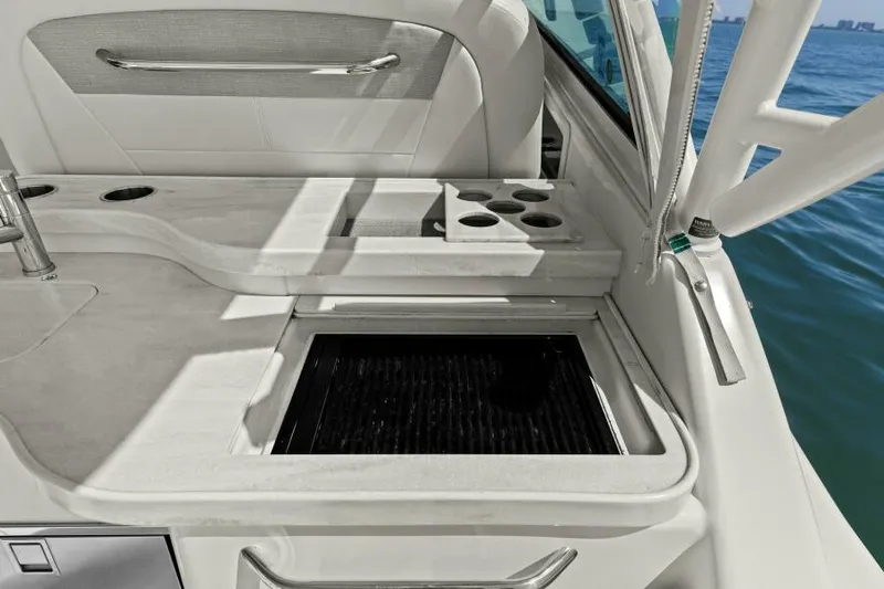  Yacht Photos Pics 2016 Grady-White Freedom 375 boat interior with cup holders and storage.