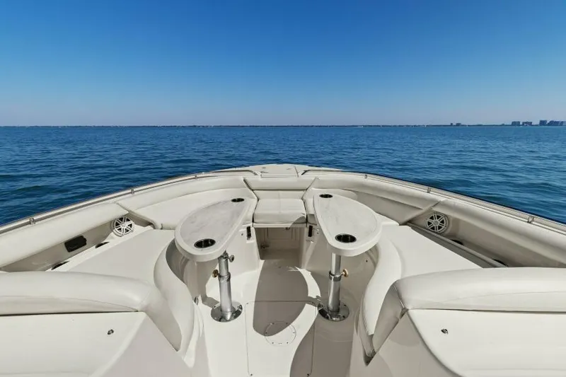  Yacht Photos Pics 2016 Grady-White Freedom 375 boat on open water, featuring spacious seating and clear blue skies.