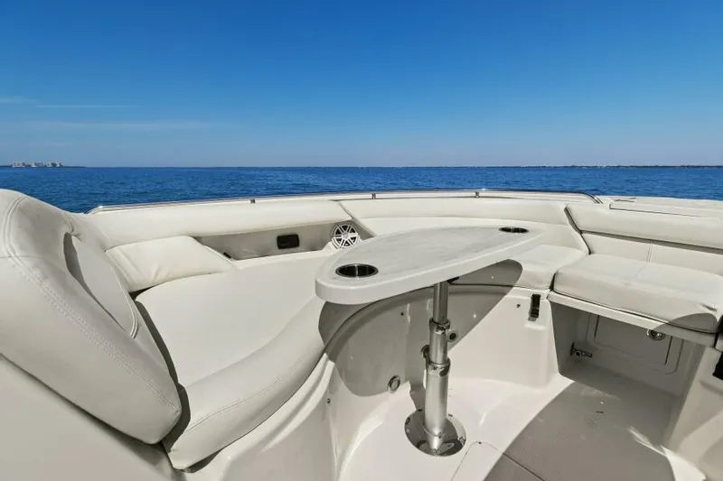  Yacht Photos Pics 2016 Grady-White Freedom 375 boat interior with seating and table, ocean view.