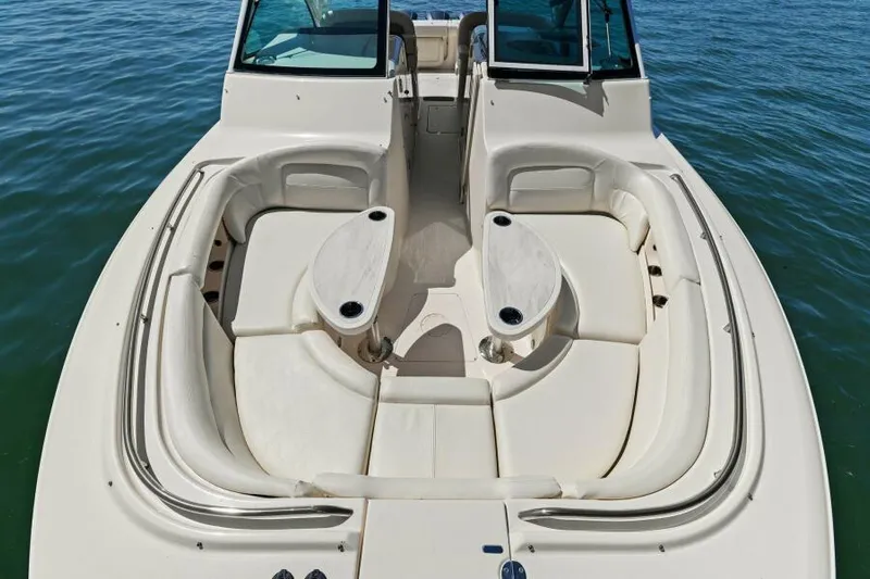  Yacht Photos Pics 2016 Grady-White Freedom 375 boat with spacious seating and dual tables on calm water.