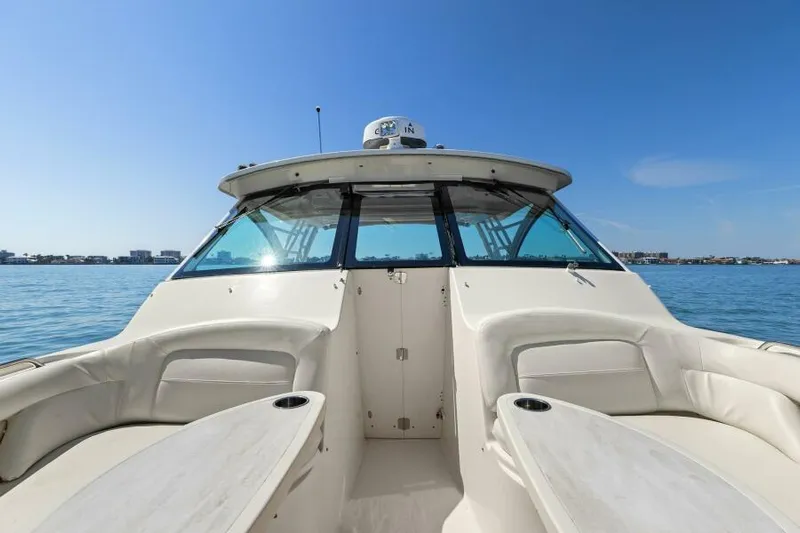  Yacht Photos Pics 2016 Grady-White Freedom 375 boat on calm water, clear sky background.