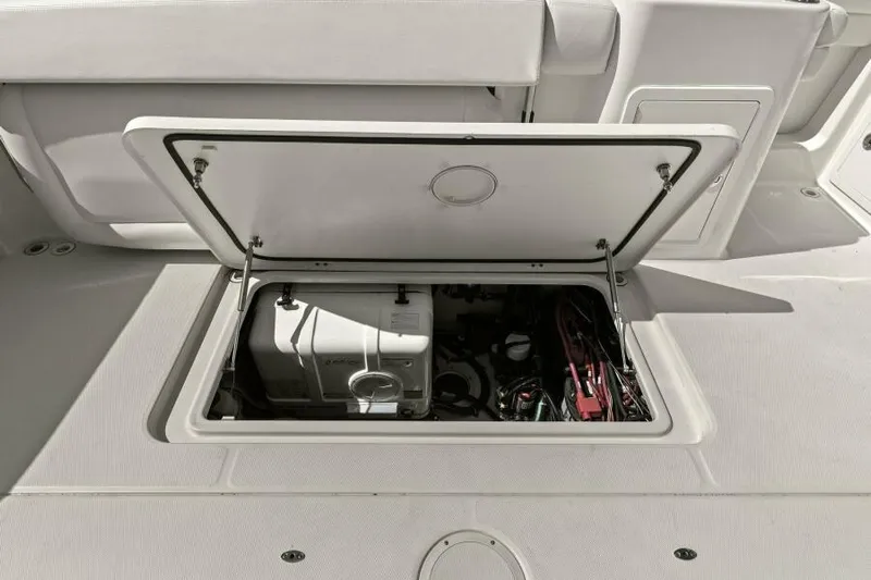  Yacht Photos Pics Open engine compartment of 2016 Grady-White Freedom 375 boat, showcasing internal components.