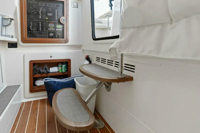  Yacht Photos Pics 2016 Grady-White Freedom 375 interior with wooden steps and control panel.