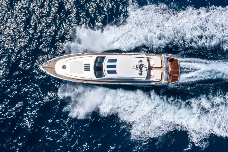 P'tite Bouille Yacht Photos Pics Aerial view of 2008 Princess V70 yacht cruising on open sea.