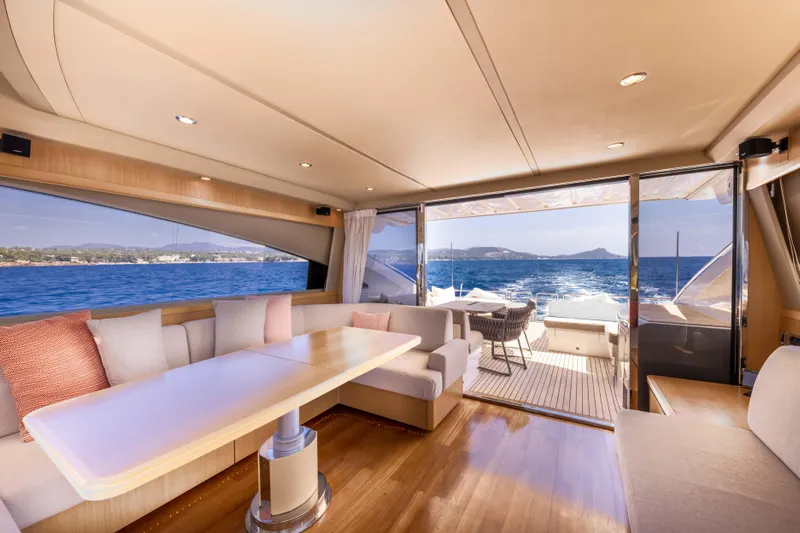 P'tite Bouille Yacht Photos Pics Luxurious interior of 2008 Princess V70 yacht with ocean view and elegant seating area.