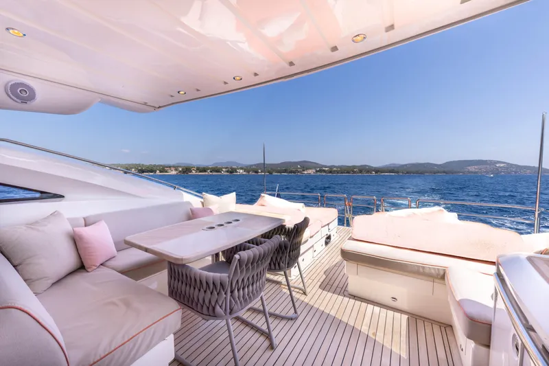 P'tite Bouille Yacht Photos Pics Luxurious 2008 Princess V70 yacht deck with elegant seating and ocean view.