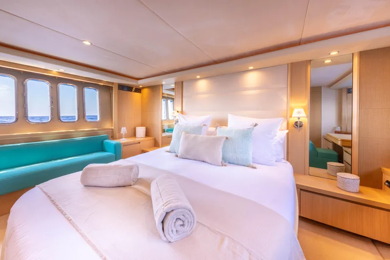 P'tite Bouille Yacht Photos Pics Luxurious bedroom interior on 2008 Princess V70 yacht with ocean view.