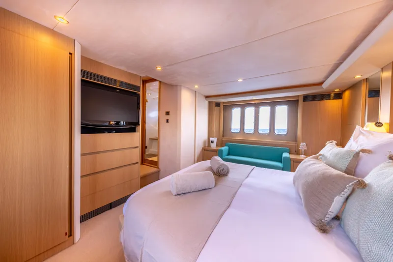 P'tite Bouille Yacht Photos Pics Luxurious bedroom interior of 2008 Princess V70 yacht with modern decor and natural lighting.